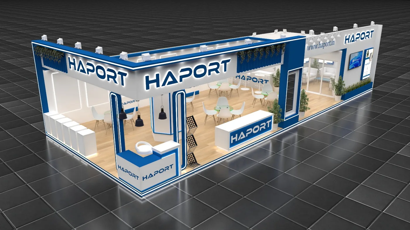 Blue and white corner exhibition stand with illuminated logo fascia, meeting tables and counters